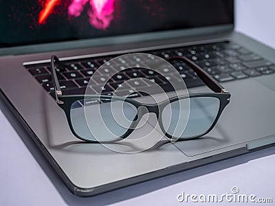 Blue light blocking glasses. Black frame glasses for filtering blue light from the computer. Prevent Computer Vision Syndrome. Eye Stock Photo