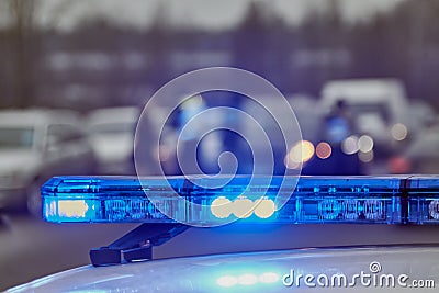 Blue lights of a police car at the scene of an accident Stock Photo