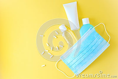 Blue medical mask, gel antiseptic for hand, antibacterial sanitizer. Stock Photo