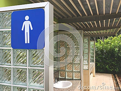 Blue Men Toilet Icon on a Sign. Public Restroom with a Male Symbol. Interior of Gas Station Terminal. Thailand. Stock Photo