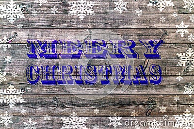 Blue Merry Christmas writen on wooden board with snoflake Stock Photo