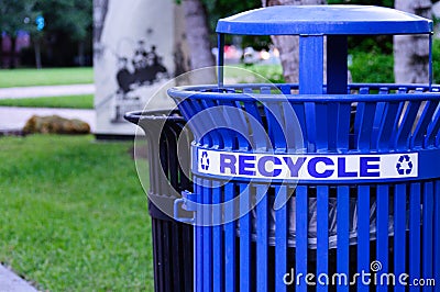Blue Metal Recycling Bin in a Park Stock Photo