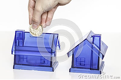 Blue money boxes - house Stock Photo