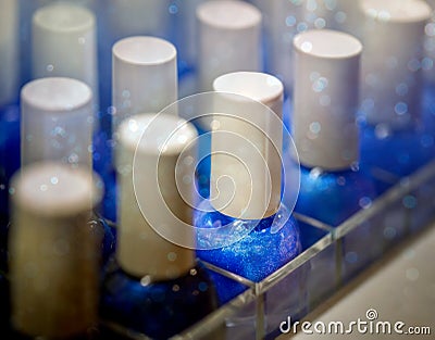 Rows of blue nail polish in store Stock Photo