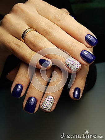Blue nails with crystals Swarovski Stock Photo