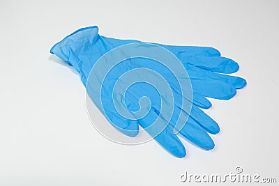 Blue nitrile medical gloves on white table. Stock Photo