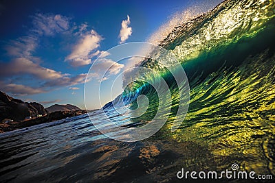 Blue ocean shorebreak wave side view Stock Photo
