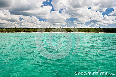 Blue ocean before stone sand beach Stock Photo