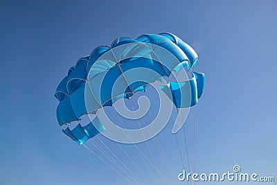 Blue open parachute for paragliding watersports Stock Photo