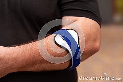 Orthosis using for tennis elbow therapy Stock Photo