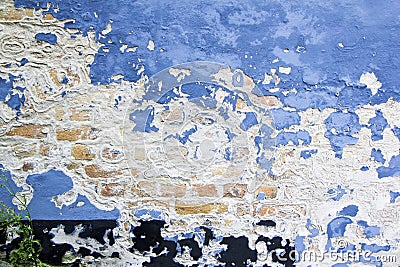 Blue paint peeling old brick wall background texture Stock Photo