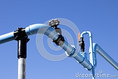 Blue painted pipework Stock Photo