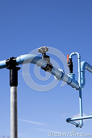 Blue painted pipework Stock Photo