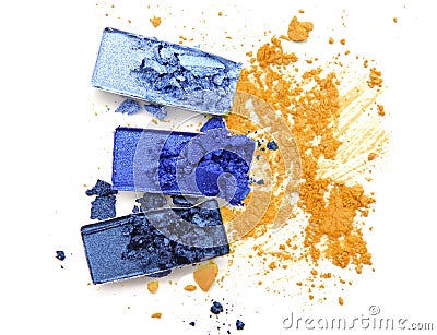 Blue palette eye shadow on yellow crushed cosmetic color Stock Photo