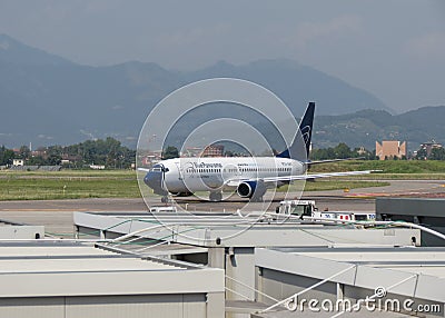 Blue Panorama Boeing 737 on the runway in Orio al Serio Editorial Stock Photo