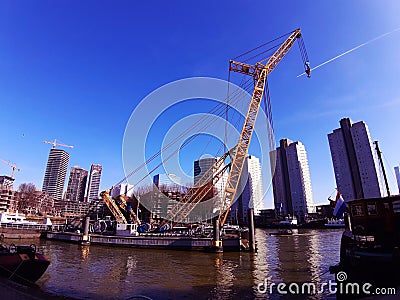 Blue panorama of the Erasmus bridge from Rotterdam on the river Editorial Stock Photo