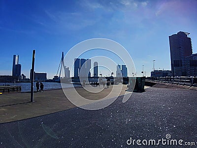 Blue panorama of the Erasmus bridge from Rotterdam on the river Editorial Stock Photo