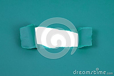 Blue paper damaged torn with white hole isolated copyspace for text Stock Photo