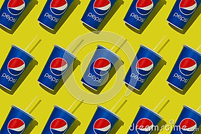 Blue paper glass with Pepsi. Takeaway carbonated drink in a cap and straw. Brand logo. Glasses pattern. Yellow Editorial Stock Photo