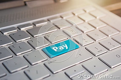 Blue pay keyboard button, Color button on the gray silver keyboard of modern ultrabook. caption on the button Stock Photo