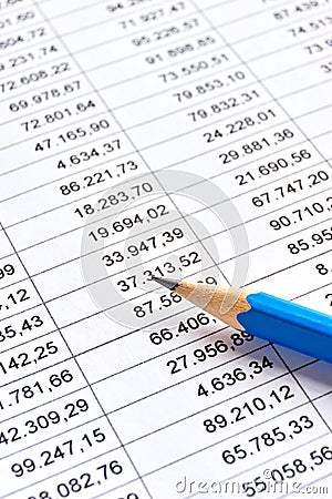 Paper with printed financial data and blue pencil Stock Photo