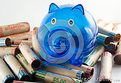 Blue Piggy Bank With Coin Wrappers Stock Photo