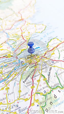 A blue pin stuck in Edinburgh on a map of Scotland portrait Stock Photo