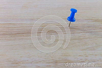 Blue pin on the wood Stock Photo