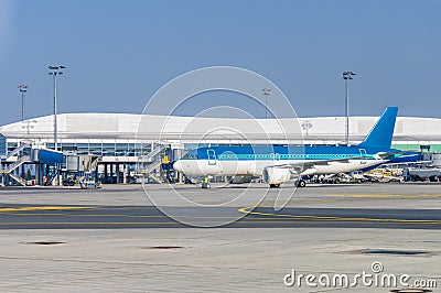 Blue plane in an airport Stock Photo