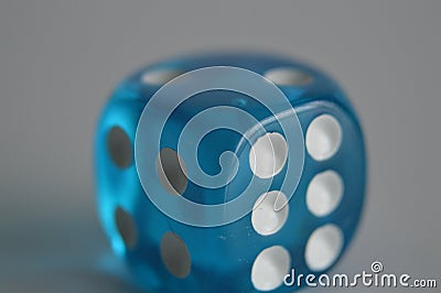 Blue plastic arcylic d6 six sided die dice close up variable focus Stock Photo