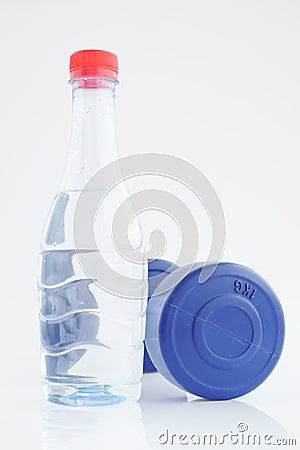 Blue plastic coated dumbells And Water Bottle Stock Photo