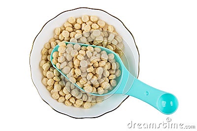 Plastic spoon in oat bran in bowl isolated on white Stock Photo