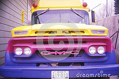 A blue purple yellow bus in Oregon Editorial Stock Photo