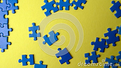 Scattered puzzle pieces on colored background Stock Photo