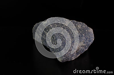 Blue Quartz Stone Mineral Blue Color on Dark Background. Stock Photo