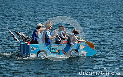 Blue race car milk carton boat Editorial Stock Photo
