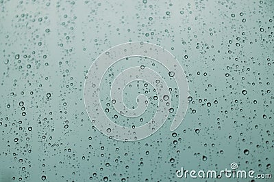 Blue raindrops on glass, abstract liquid texture Stock Photo