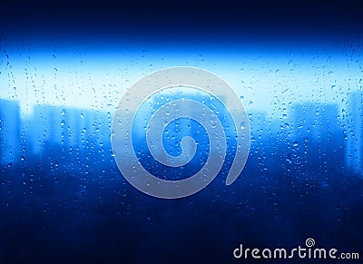 Blue raindrops on window city texture background Stock Photo