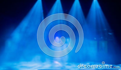 Blue rays of light from the spotlights through the smoke on the stage. Theatrical performance. Defocused abstract image Stock Photo