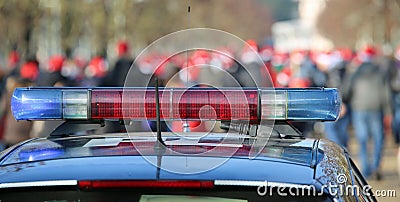 blue and red sirens on the police car in the public urban park Stock Photo