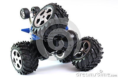 A blue remote controlled monster truck toy car with flexible rotating front wheels Stock Photo