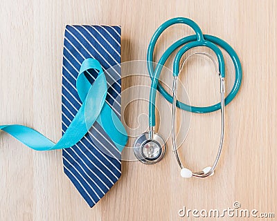 Blue ribbon symbolic for prostate cancer awareness and men`s health in November month on necktie, doctor`s stethoscope Stock Photo