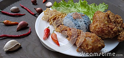 Blue Rice and Fried Chicken Stock Photo