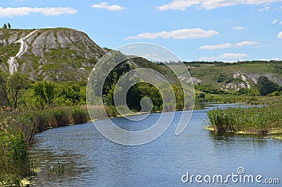 the river flows under the mountain. Stock Photo