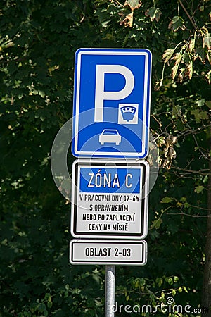 Blue road sign with information about the paid parking zone Editorial Stock Photo