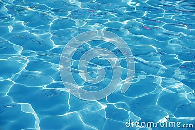 Blue romantic rippling water surface with sun glare Stock Photo