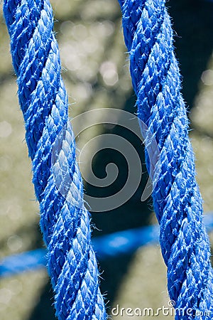 Blue ropes and connecting links closeup Stock Photo