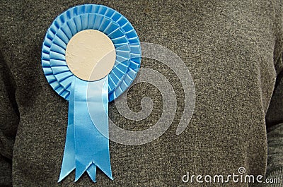 Blue Rosette on Conservative Party Supporter Stock Photo