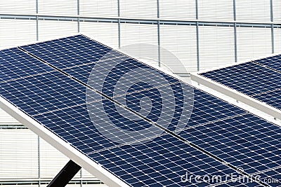 Blue rotating solar panels tilted axis tracker, future energy concept Stock Photo