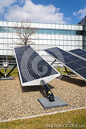 Blue rotating solar panels tilted axis tracker, future energy concept Stock Photo